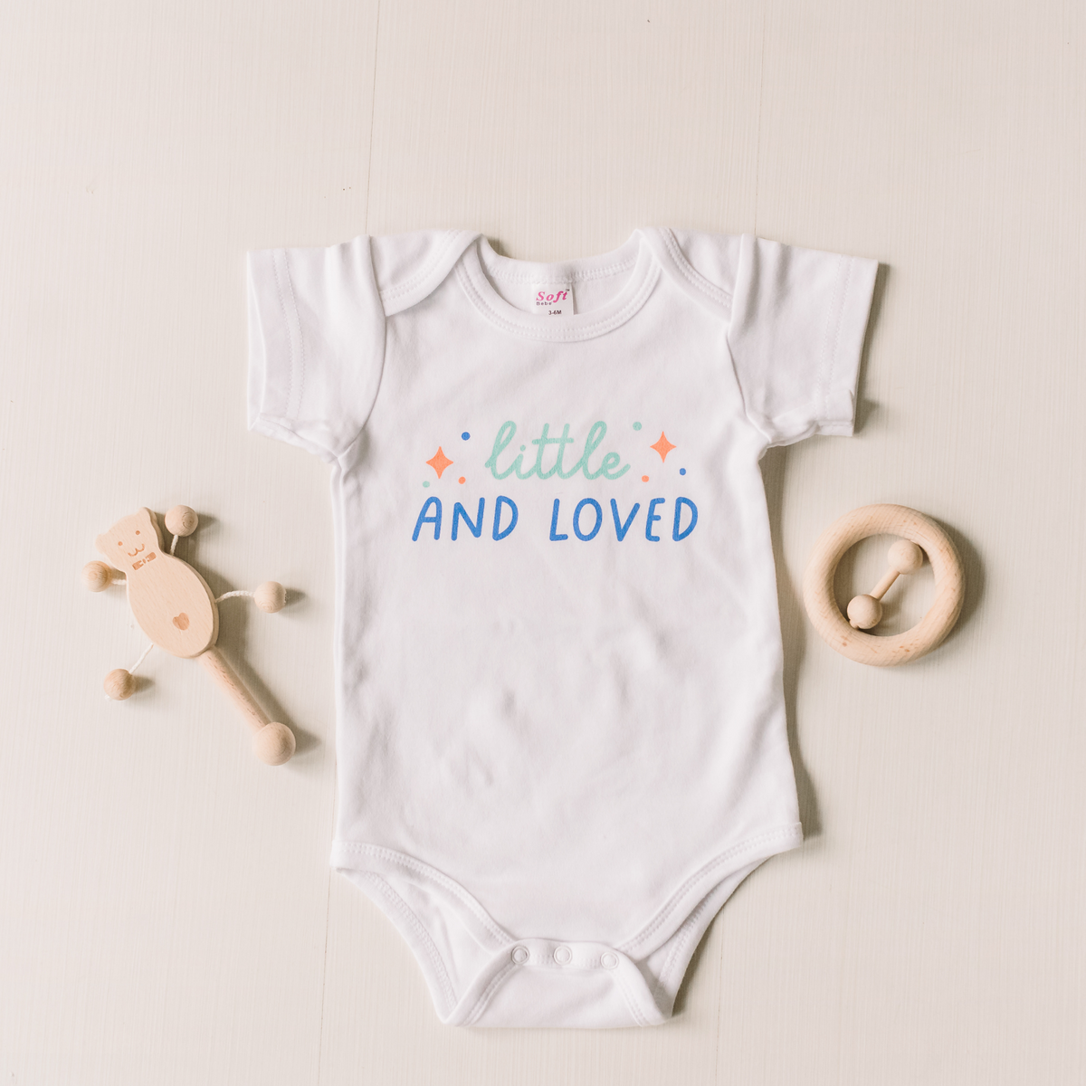 Little and Loved Baby Bodysuit